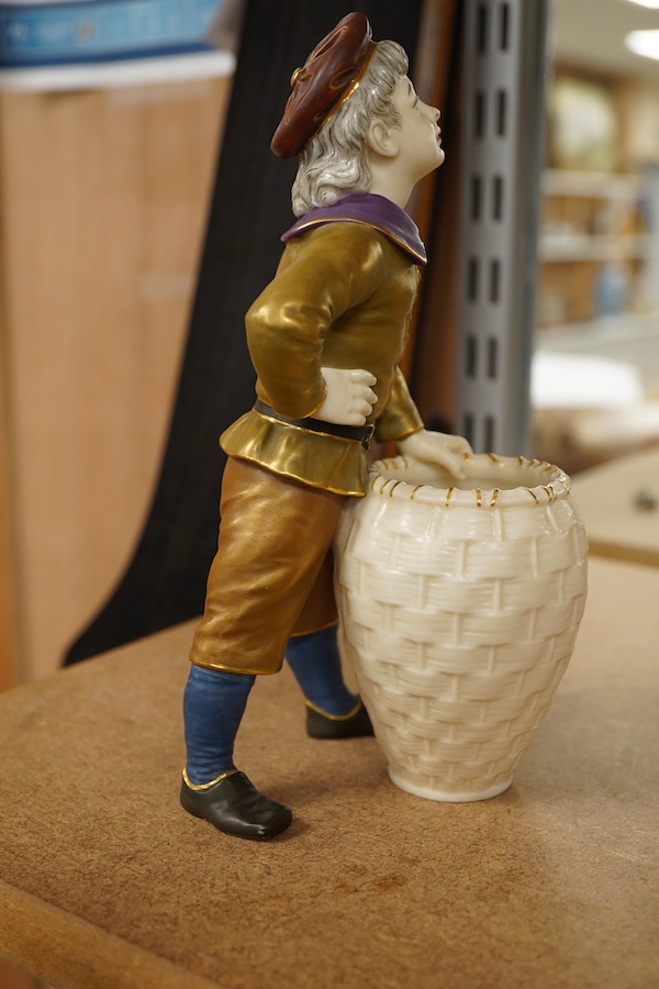 A late 19th century Royal Worcester figure of a boy with basket, 17.5cm high